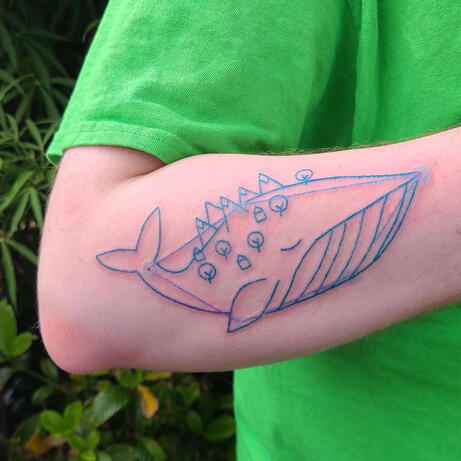 blue line tattoo of a constellation of a whale from the video game night in the woods