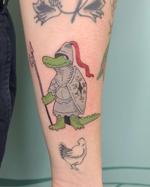color tattoo of a cartoon alligator in knightly armor.